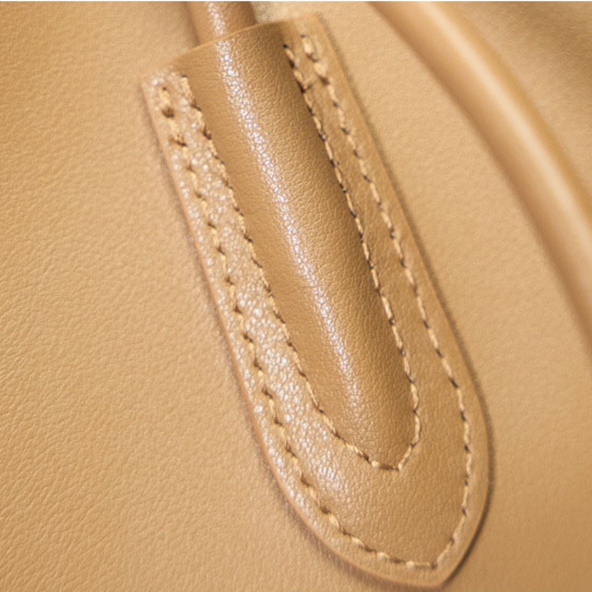 Leather tote bag closeup on handle