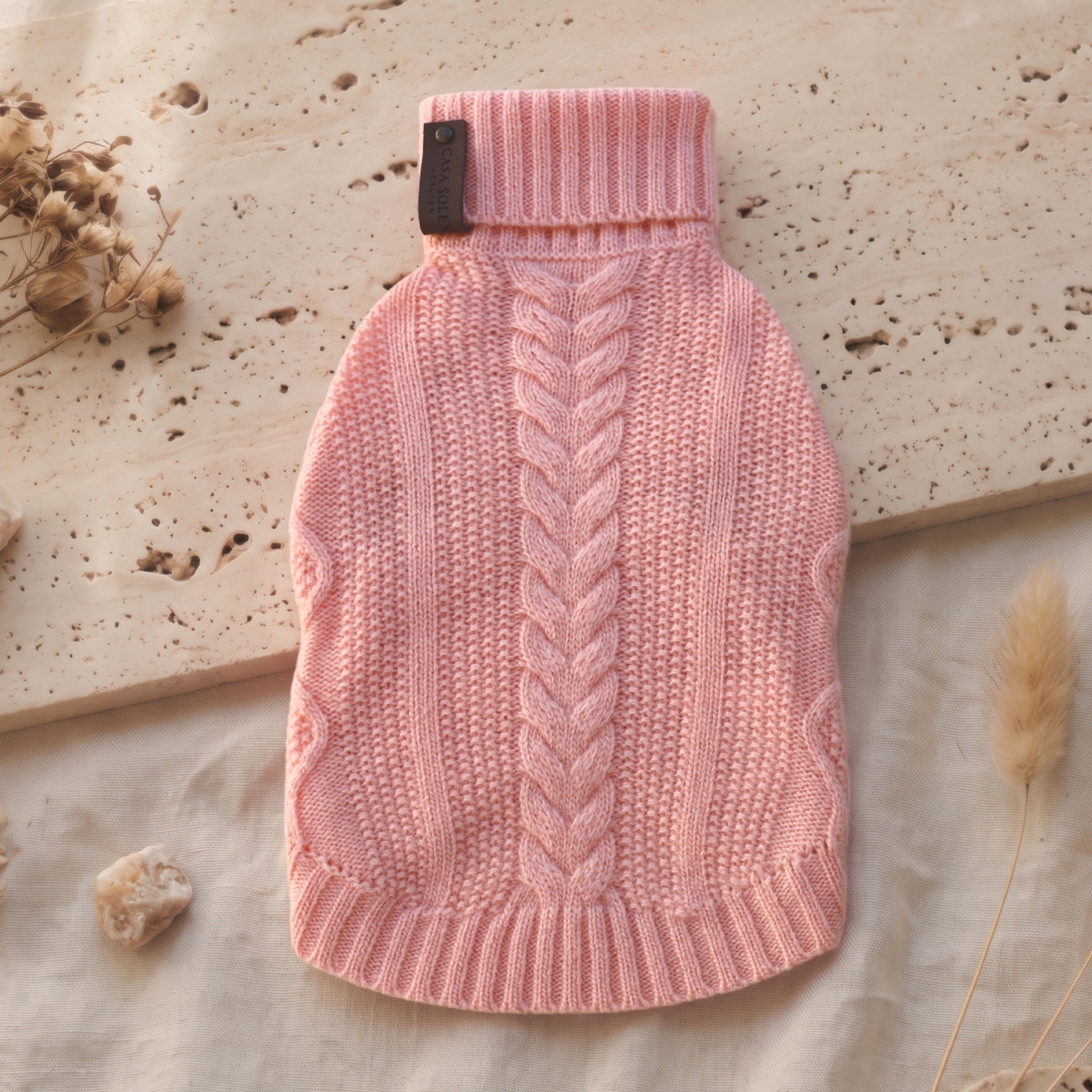 Coral rose cable-knit turtleneck pullover with ribbed collar and hem