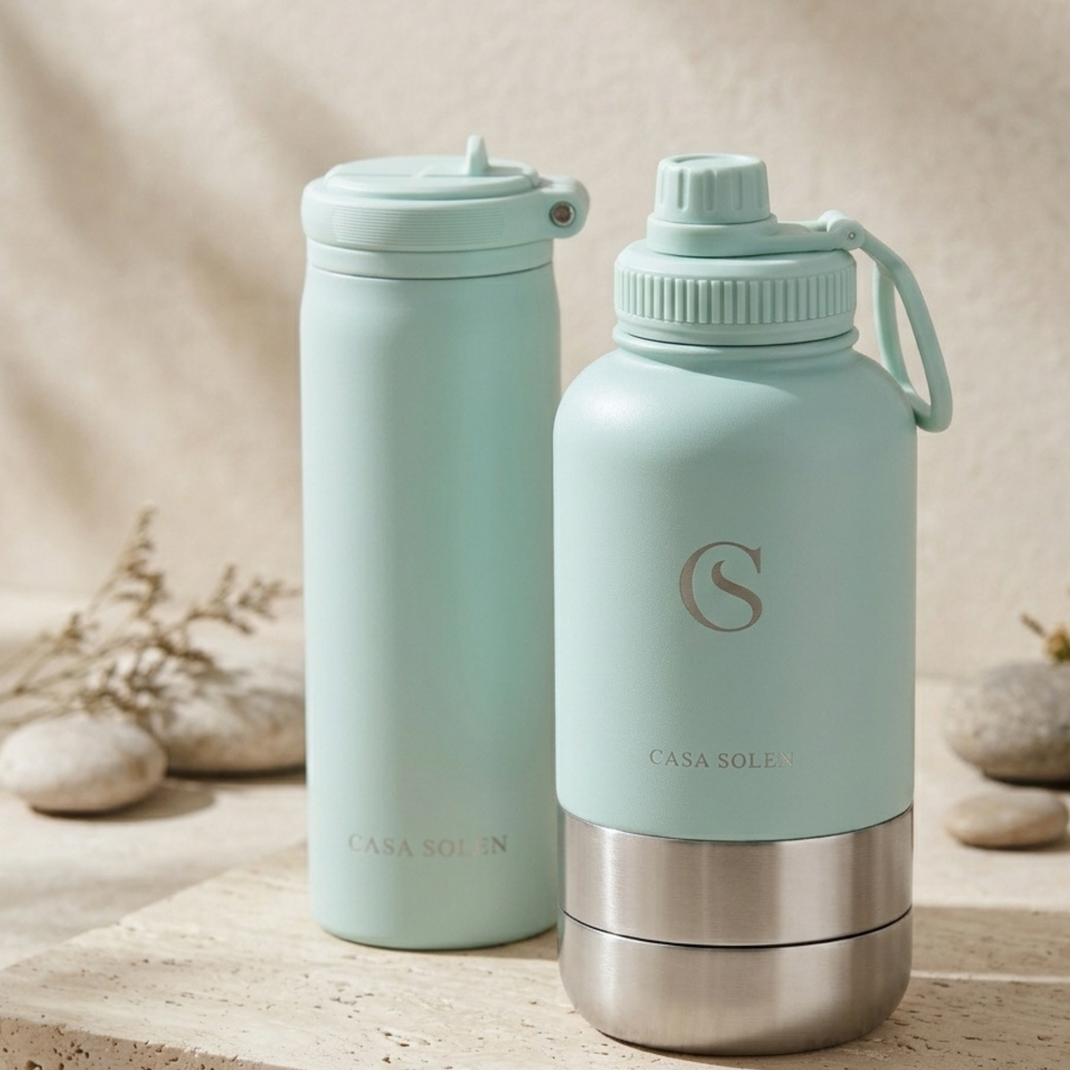 Insulated stainless steel drink bottle, mint-blue body with flip-top lid and handle loop