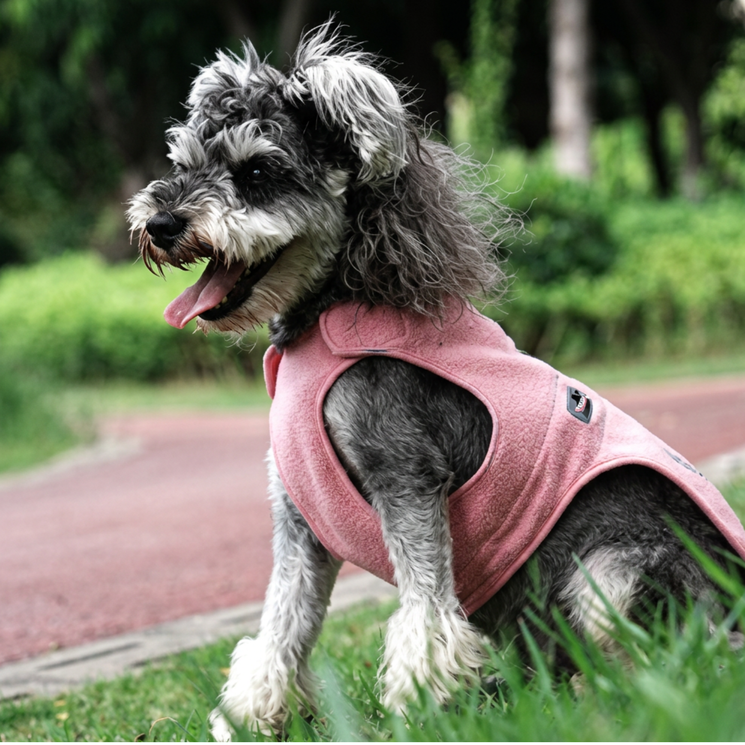 Truelove pink fleece dog jacket with velcro attachments, adjustable strings and reflective logo
