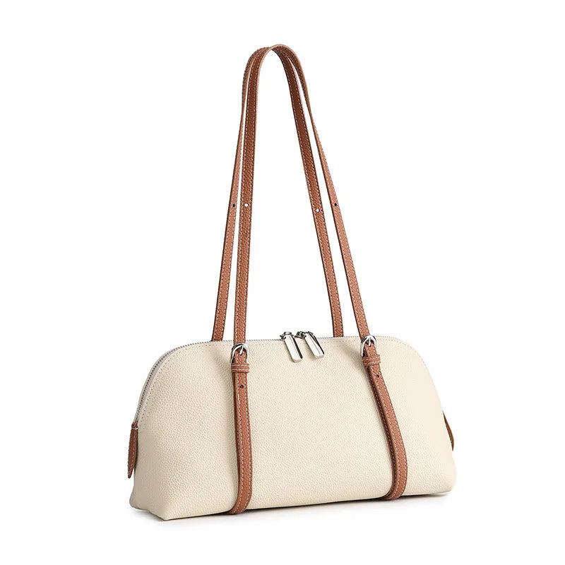Two-tone leather tote bag with top zip and tan handles
