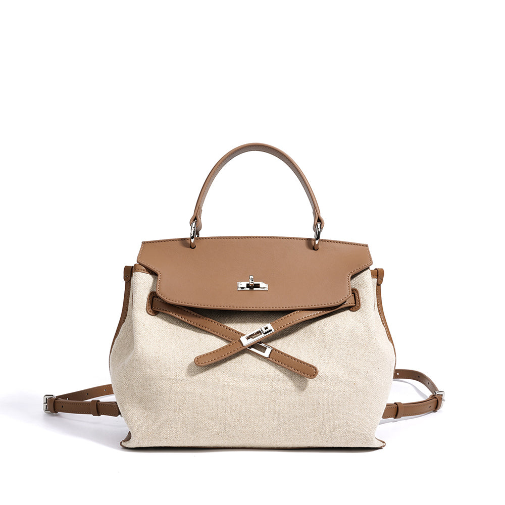 Oat and cognac leather bag with front flap, top handle, and crossbody strap