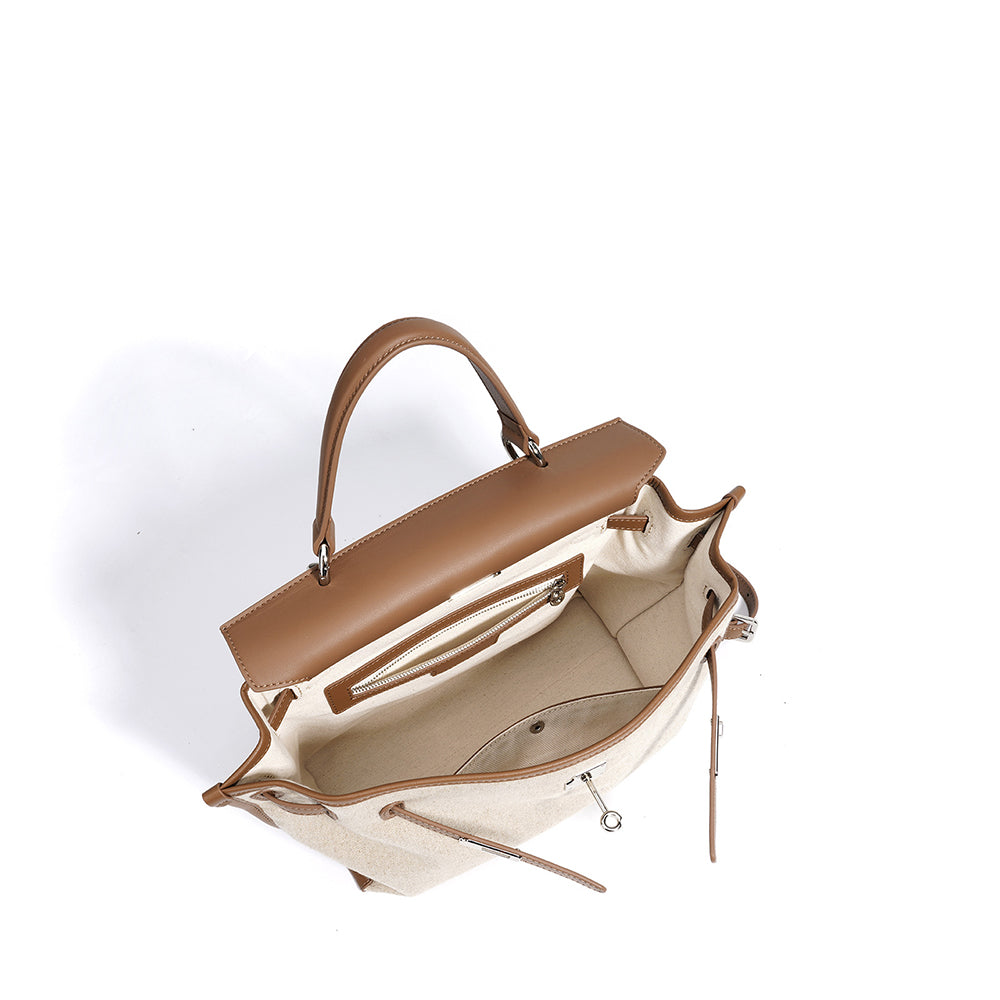 Oat and cognac leather bag open view with adjustable straps and side pockets