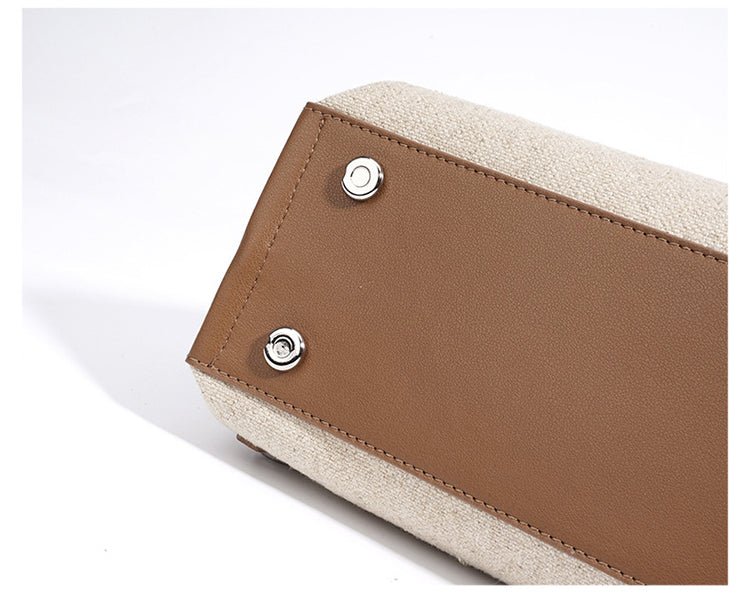 Cognac leather flap corner with snap hardware on oat textured body