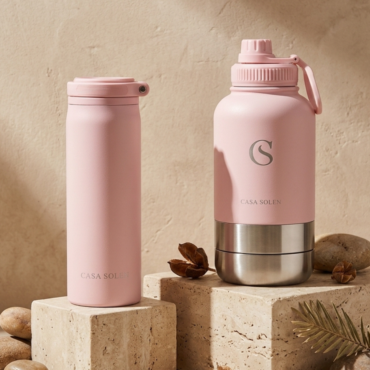 Powder blush pink insulated stainless steel drink bottle with screw-top lid and carry loop