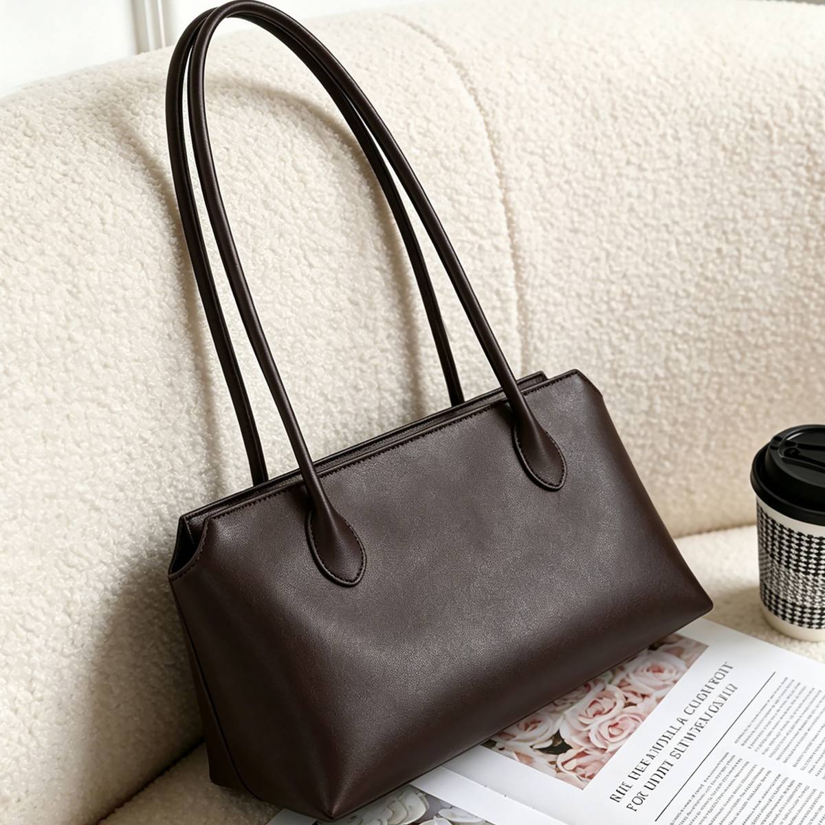 Espresso brown leather tote bag with top handles and wide structured shape