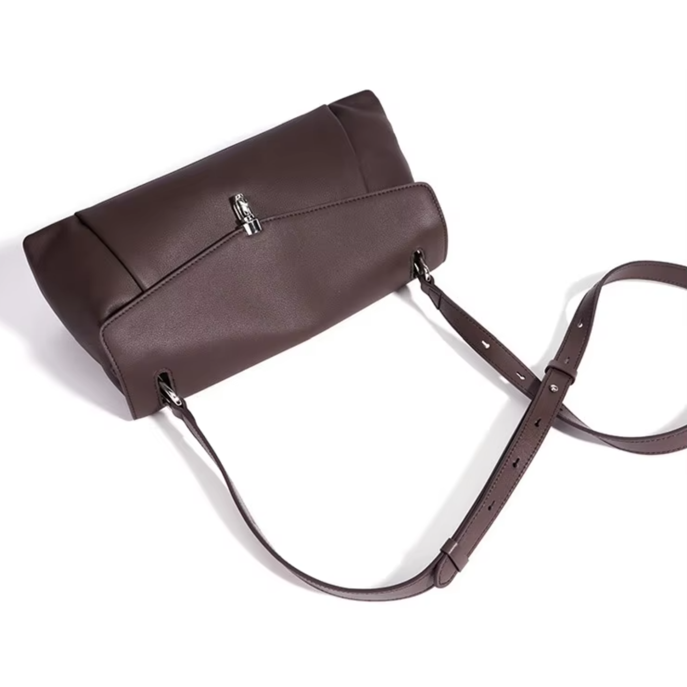 Espresso leather handbag with front flap, silver clasp, and adjustable shoulder strap