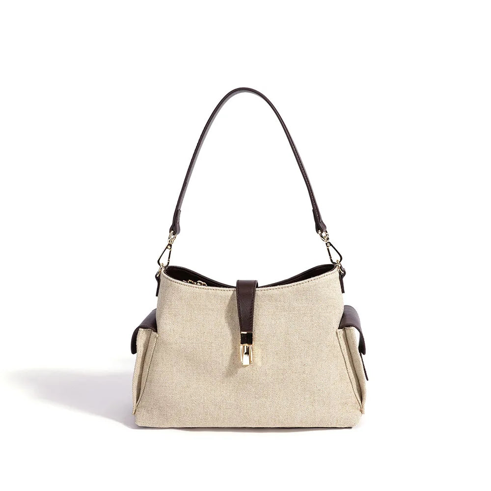 Oat and espresso leather bag with top handles, shoulder strap, and center zip