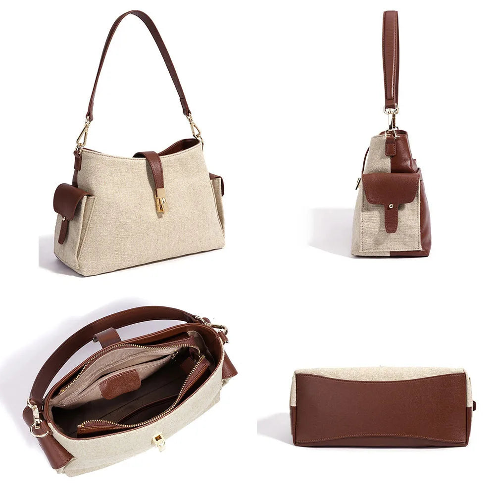 Cream canvas bag with brown leather top handles, front zipper pocket, gold hardware