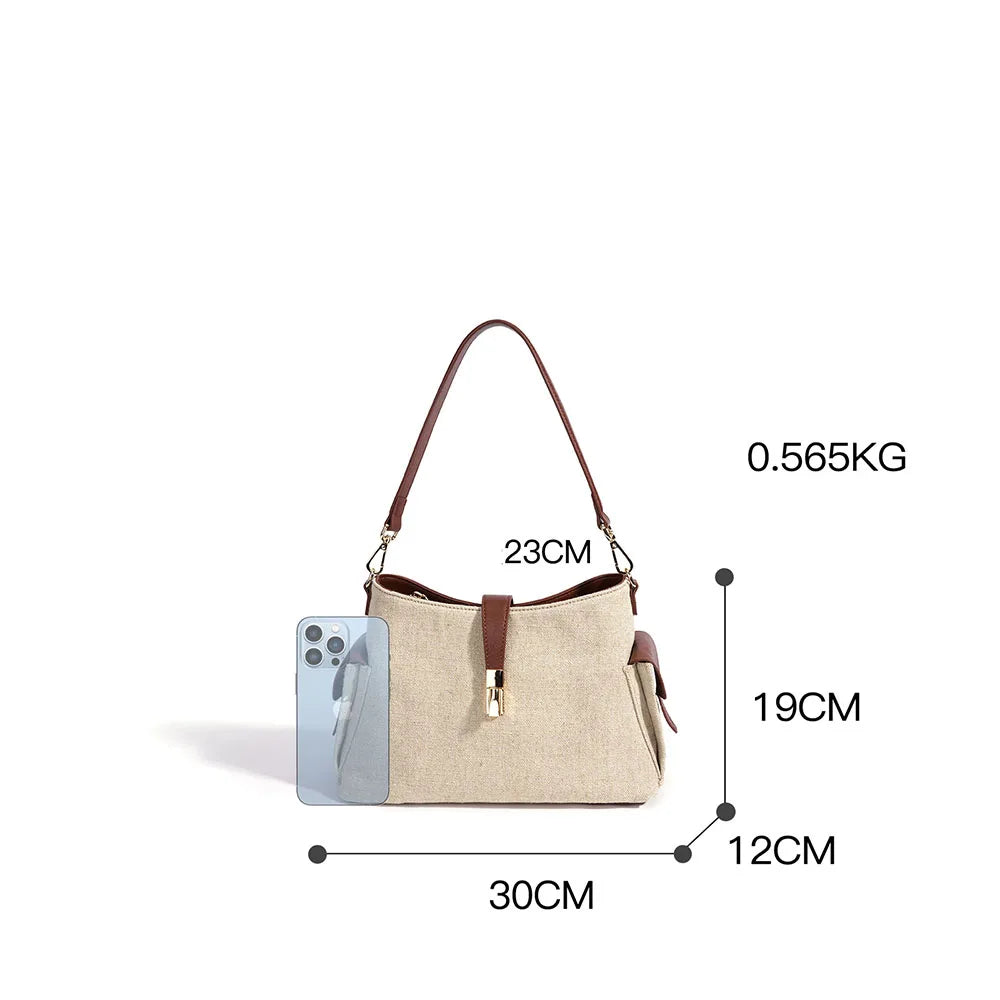 Cream bag with brown leather trim; 30×19×12cm, 0.565kg; gold zipper